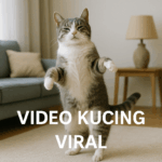 Kucing berwarna putih abu-abu sedang berdiri di dua kaki dan menari lucu di ruang tamu modern dengan tulisan Video Kucing Viral